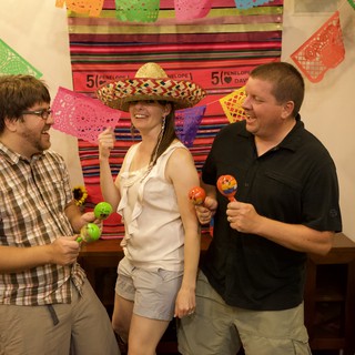 Friends Celebrate with Maracas at Fiesta Anniversary Party