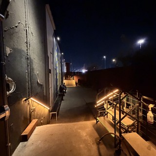 Illuminated Industrial Walkway at Dawn