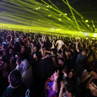 Massive EDM Crowd Surges Under Green Laser Light Show