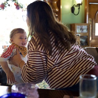 Mother and Child Share Joyful Moment at Restaurant