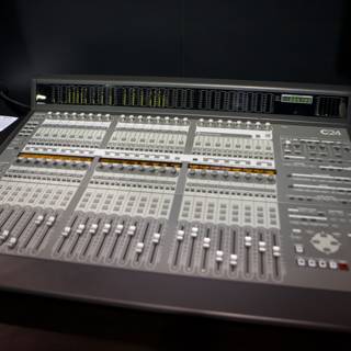 Studio Mixing Board with a Variety of Instruments