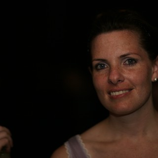 Candid Portrait of Smiling Woman at Evening Event