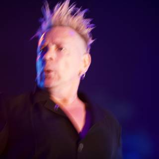 John Lydon Rocks the Stage with his Mohawk and Mic