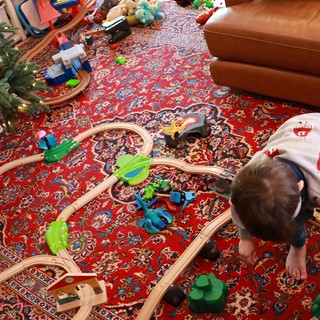 Child Playing with Train Set on Christmas Morning