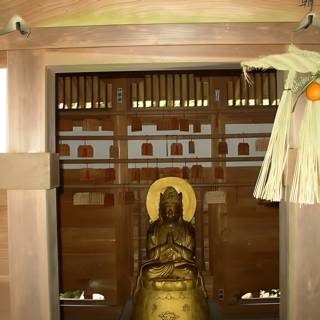 Buddha Statue in Monastery Doorway