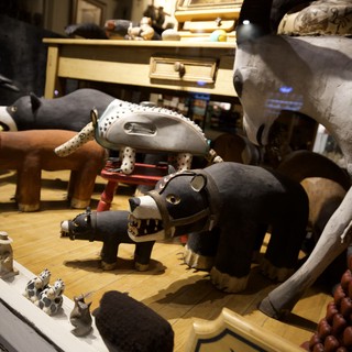 Handcrafted Folk Art Animal Collection on Wooden Display