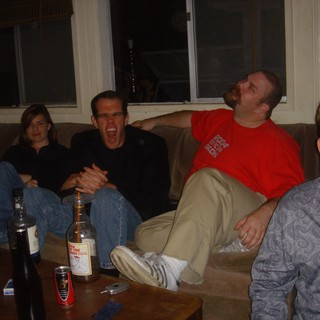 Friends Laughing Together at a House Party