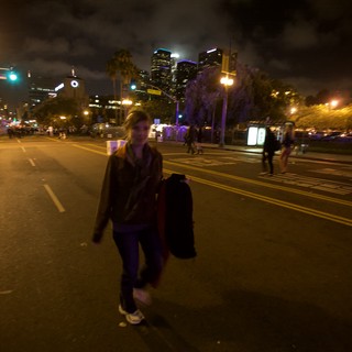 Night Walker on Empty Downtown Street at Dusk
