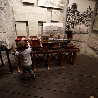 Young Child Discovers Historic Train Model at Museum