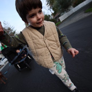 Young Child's Joyful Moment on Residential Street