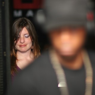 Smiling Woman at Nightclub Event in 2006