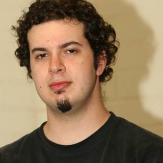 Curly-haired man in a Casual T-Shirt