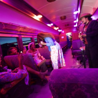 Live Music Performance on a Vibrant Train Car