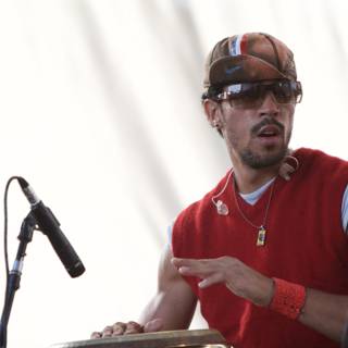 Performer in Red Shirt and Sunglasses