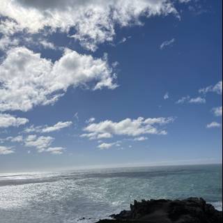 Cliffside vista of the majestic ocean and clouds