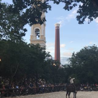 Equestrian in front of a Bell Tower