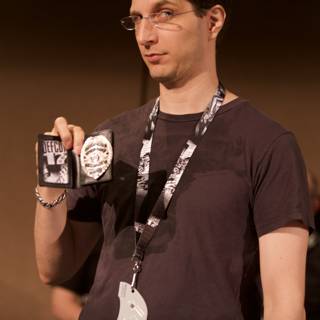Jeff M Holding Badges and Trophies at DEFCON 17