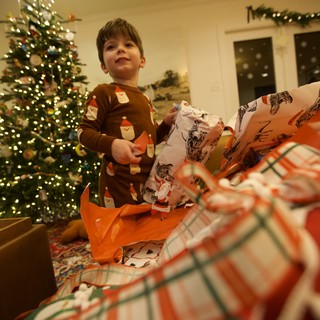 Christmas Morning Joy: Child Opening Presents