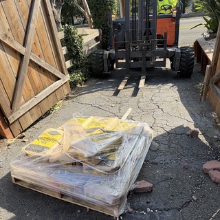 Forklift Delivering Building Materials to Residential Construction Site