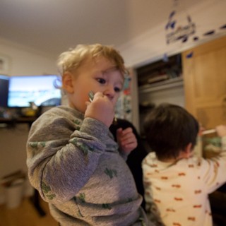 Young Children in Pajamas at Home in Kitchen