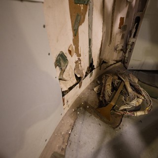 Deteriorated Door Frame with Exposed Wiring on USS Hornet