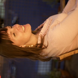 Joyful Woman Laughing in Warm Evening Light