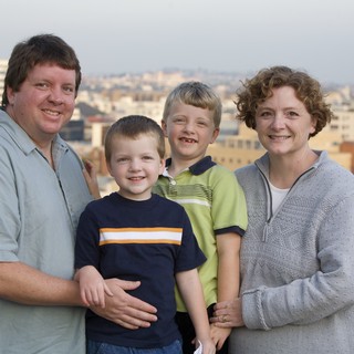 Family Portrait on Urban Rooftop at Dusk