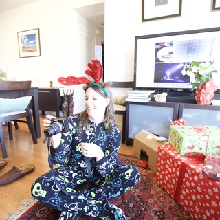 Christmas Morning Joy with Camera and Reindeer Antlers