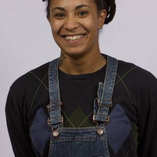 Smiling Woman in Overalls and Headband