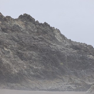 Jagged Coastal Cliffs Shrouded in Ocean Mist