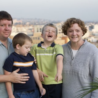 Family Portrait on Urban Rooftop at Dusk