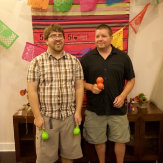 Friends Celebrate with Maracas at Fiesta Anniversary Party