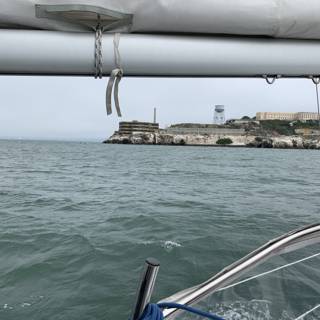 Sailboat sailing towards Alcatraz Island Lighthouse