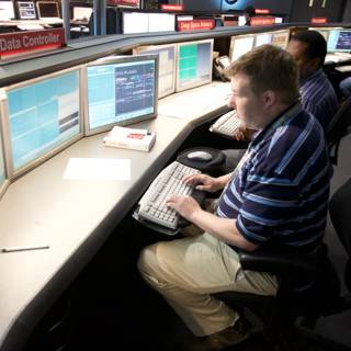 Man in a High-Tech Control Room