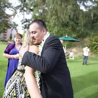 A Loving Embrace at a Hawaiian Wedding
