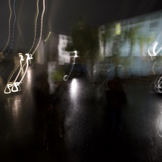 Nocturnal Motion Blur on Wet Urban Street