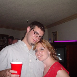 Dave and Penelope Posing Together at House Party