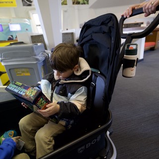 Young Reader in Stroller at Modern Museum