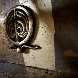 Cryptic Symbol on Bronze Handrail