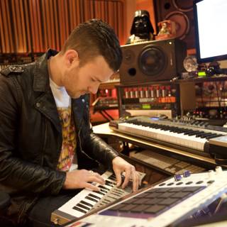 Leather Jacketed Musician Playing Electronic Keyboard