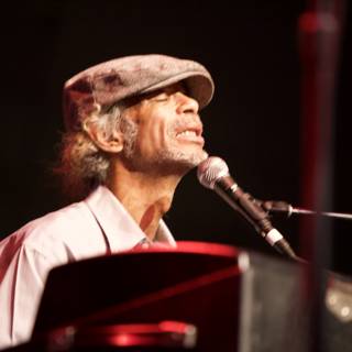 Man in Hat Performs Keyboard at 2010 Cochella Concert