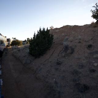 Sunset Train Journey Through Desert Landscape