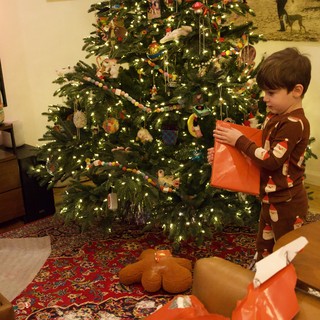 Child Opening Presents on Christmas Morning