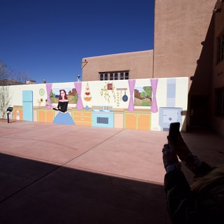 Tourist Photographing Colorful Kitchen Mural in Santa Fe
