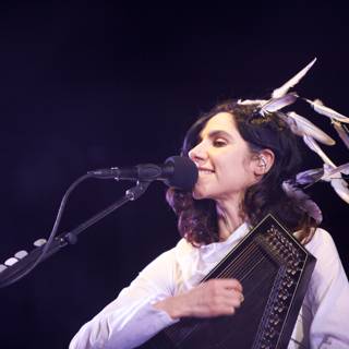 Feathers and Music: PJ Harvey's Electrifying Solo Performance