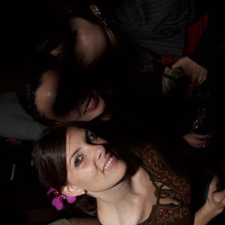 Friends Smiling Together at Nightclub Art Walk