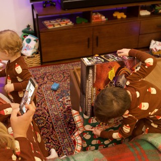 Christmas Morning Gift Opening in Matching Pajamas