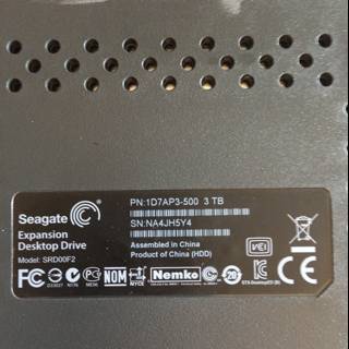 Back of Black Computer with Adapter Sticker