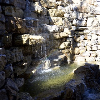 Natural Stone Waterfall Feature in Terraced Rock Garden