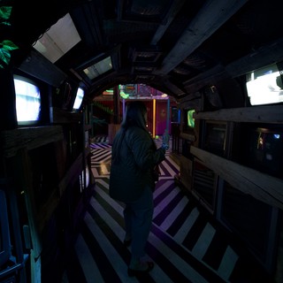 Third-Person Gaming in a Darkened Treehouse Interior